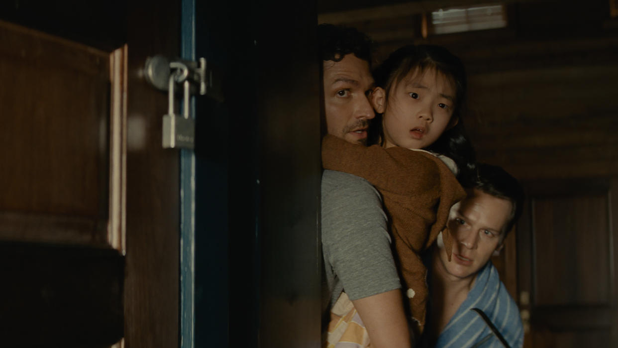 Ben Aldridge (left) plays a parent trying to protect his child in M Night Shyamalan thriller Knock at the Cabin. (Universal Pictures)