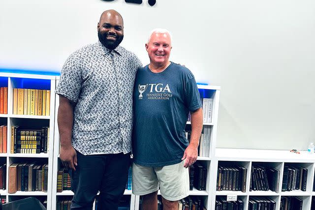 <p>Michael Oher/Instagram</p> Michael Oher poses with a reader during promotional stop on his book tour