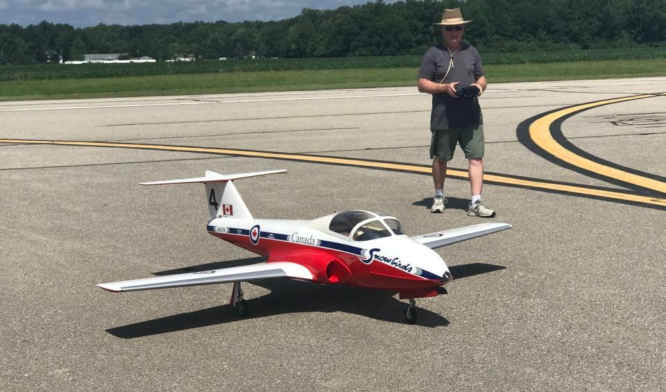 Joe Dirr of Cincinnati, Ohio, controls his model jet aircraft at Custer Airport.