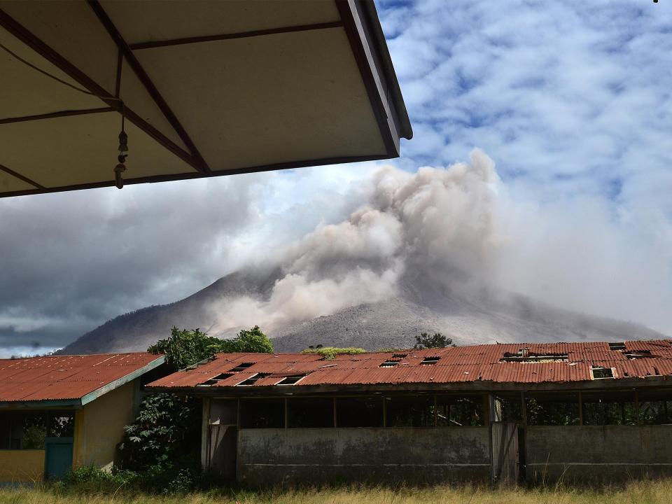 Ashes spew from Mount Sinabung.