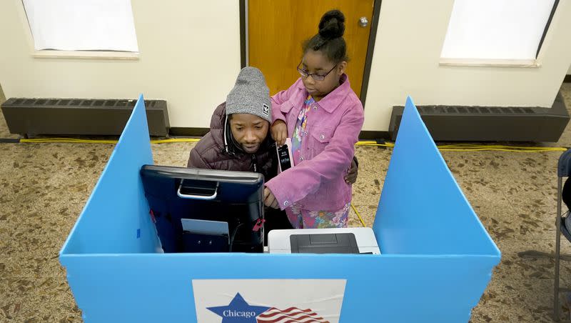 Christopher Sandridge teaches his daughter Christina the voting process as he casts a ballot at the Rev. Dr. Martin Luther King Community Center on the Southside of Chicago, Tuesday, Nov. 8, 2022.A new WalletHub survey analyzed how well the composition of an electorate reflects the demographics of the population it represents.