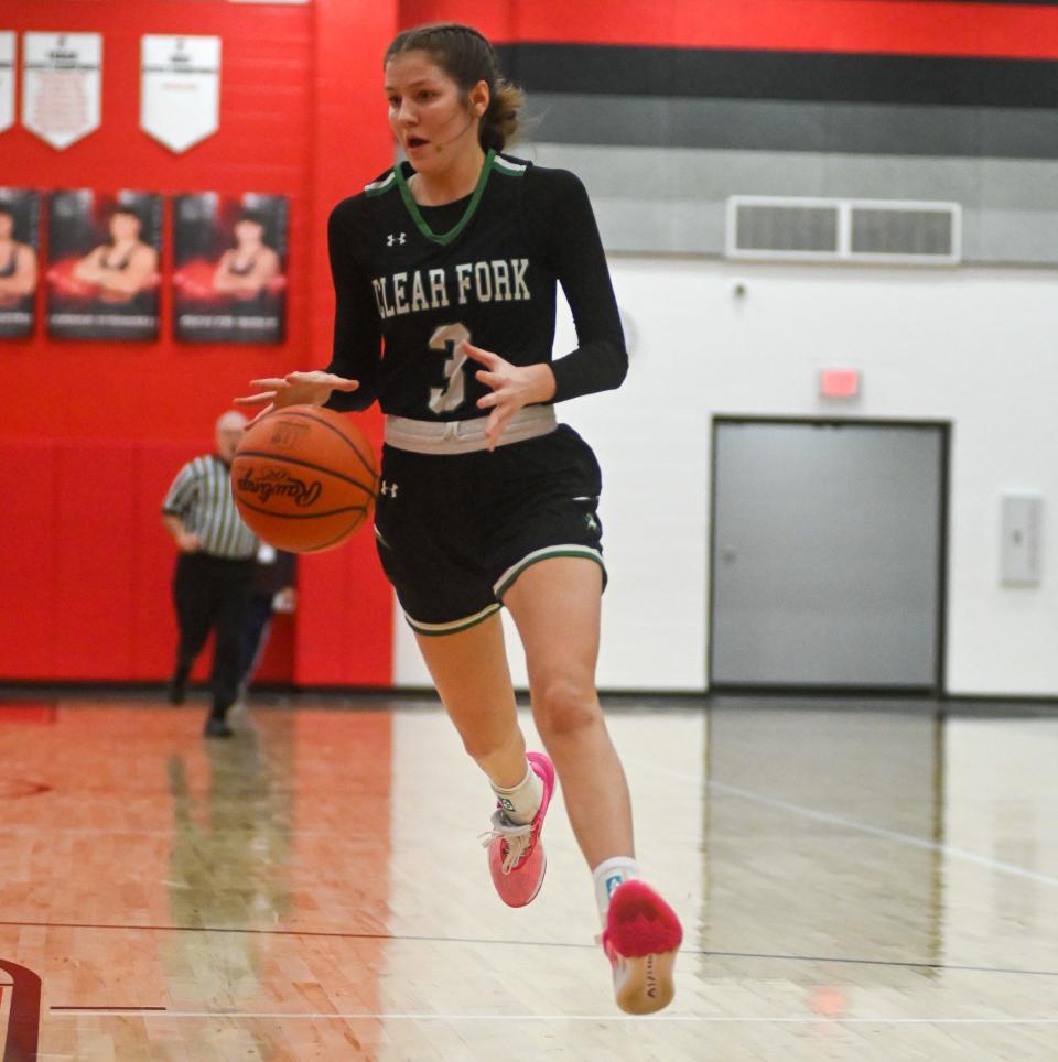 Clear Fork's Mel Blubaugh drives to the basketball during a 36-32 Mid-Ohio Athletic Conference girls basketball win over the Pleasant Spartans on Tuesday night.