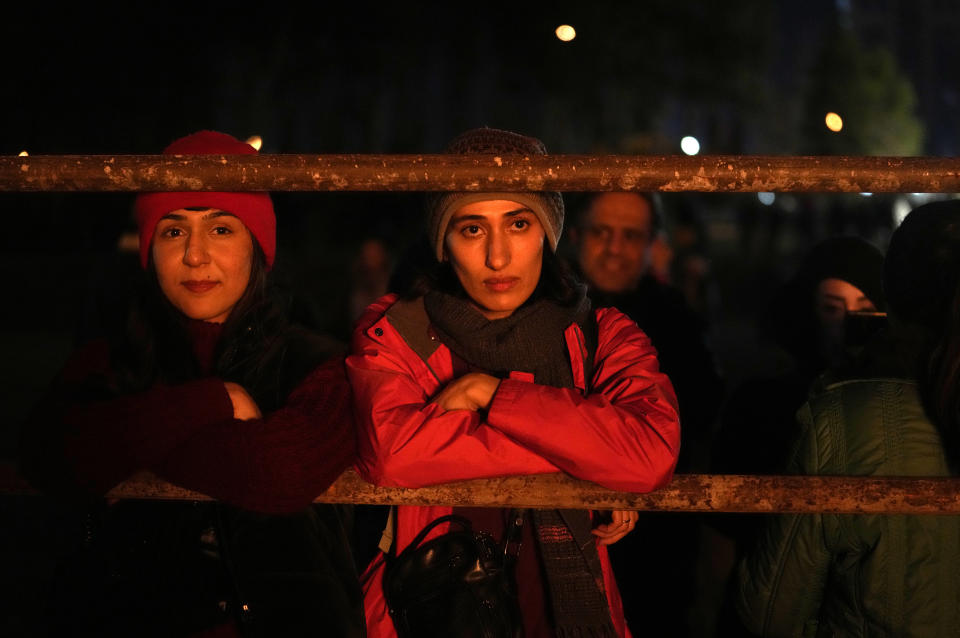 Iranian Zoroastrians look at a giant bonfire as they celebrate their ancient mid-winter Sadeh festival in outskirts of Tehran, Iran, Tuesday, Jan. 30, 2024. Hundreds of Zoroastrian minorities gathered after sunset to mark their ancient feast, creation of fire, dating back to Iran's pre-Islamic past. (AP Photo/Vahid Salemi)