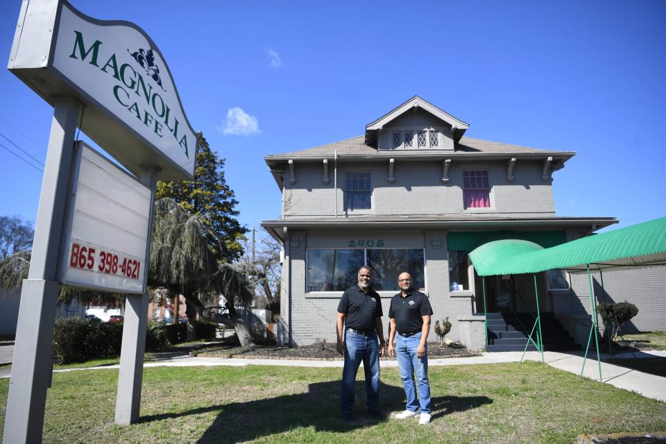 From left part-owners Rep. Sam McKenzie,and Frank Shanklin and pose for a photo outside Magnolia Cafe on Magnolia Avenue, in Knoxville, Tenn., Friday, Feb. 23, 2024. In 2021 the pair went to the cafe's owners with a proposal to buy and reopen it.