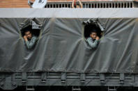 Riot security forces look on while waiting during a rally against President Nicolas Maduro in Caracas, Venezuela May 24, 2017. REUTERS/Carlos Barria