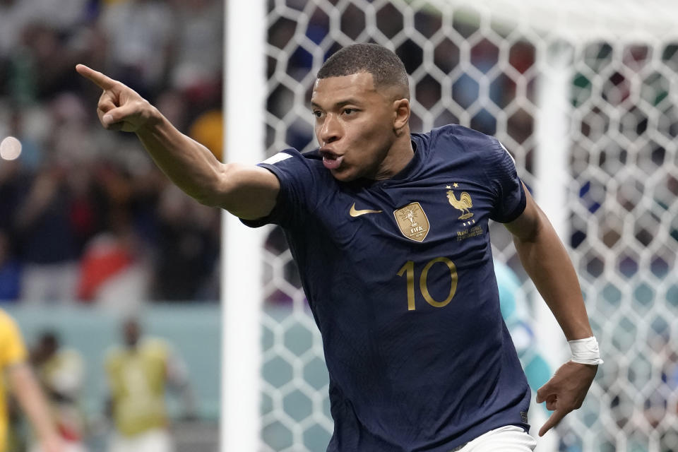 France's Kylian Mbappe celebrates after scoring against Australia during the World Cup group D soccer match between France and Australia, at the Al Janoub Stadium in Al Wakrah, Qatar, Tuesday, Nov. 22, 2022. (AP Photo/Christophe Ena)