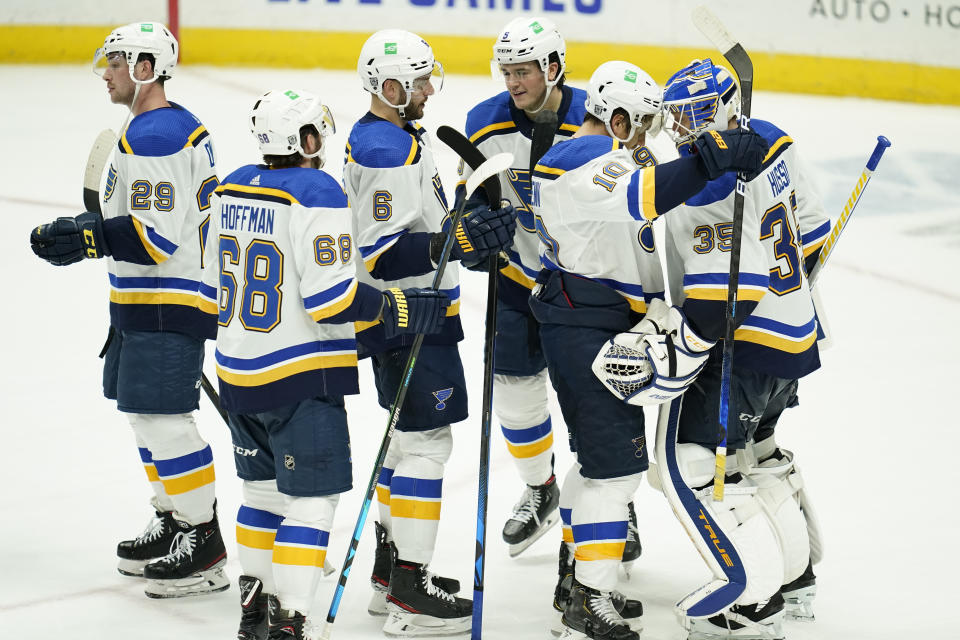 The St. Louis Blues celebrate a win over the Anaheim Ducks after an NHL hockey game Sunday, Jan. 31, 2021, in Anaheim, Calif. (AP Photo/Ashley Landis)