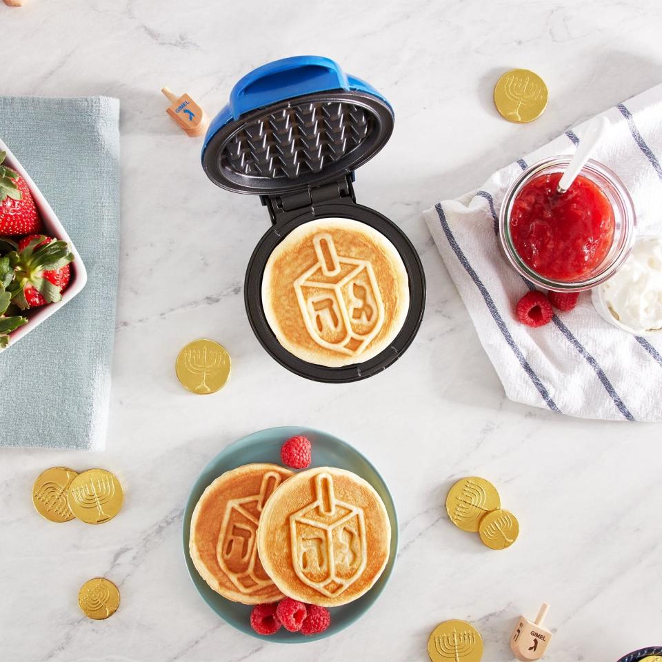 <p><a href="https://go.redirectingat.com?id=74968X1596630&url=https%3A%2F%2Fwww.walmart.com%2Fip%2FDash-Dreidel-Mini-Waffle-Maker-4-Non-Stick-Blue%2F679612708&sref=https%3A%2F%2Fwww.thepioneerwoman.com%2Fholidays-celebrations%2Fgifts%2Fg45825939%2Fhanukkah-gifts%2F" rel="nofollow noopener" target="_blank" data-ylk="slk:Shop Now;elm:context_link;itc:0;sec:content-canvas" class="link ">Shop Now</a></p><p>Dash Dreidel Mini Waffle Maker</p><p>walmart.com</p><p>$29.95</p>