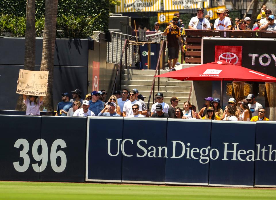 Family and friends of Colorado Rockies catcher Brian Serven watch from the outfield during a game against the Padres at Petco Park in San Diego, Calif., Saturday, June 11, 2022. 