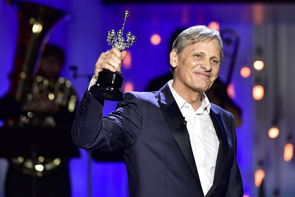 US actor and film director Viggo Mortensen, smiles after receiving the Donostia Award for his contribution to the cinema during the 68th San Sebastian Film Festival, in San Sebastian, northern Spain, Thursday, Sept. 24, 2020. (AP Photo/Alvaro Barrientos)