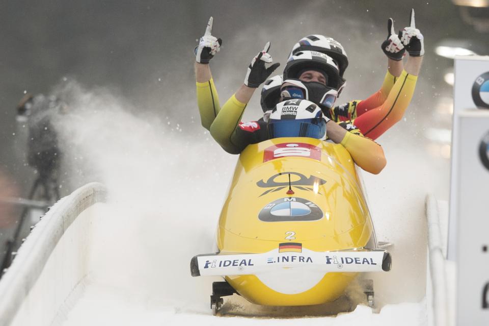 Germany's Francesco Friedrich, Candy Bauer, Martin Grothkopp und Thorsten Margis celebrate after the second run of the bob world cup in Altenberg, Germ,any, Sunday, Jan.6, 2019. (Sebastian Kahnert/dpa via AP)