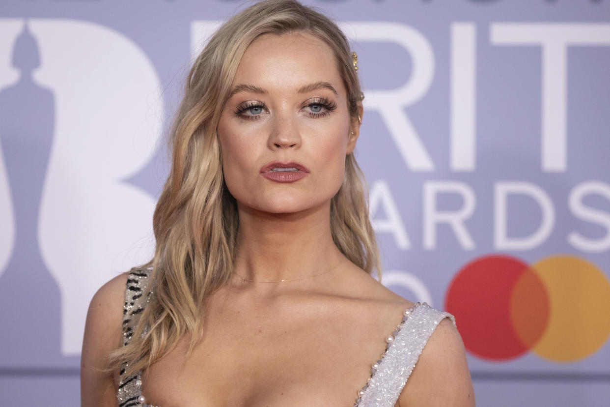 Laura Whitmore poses for photographers upon arrival at Brit Awards 2020 in London, Tuesday, Feb. 18, 2020.(Photo by Vianney Le Caer/Invision/AP)