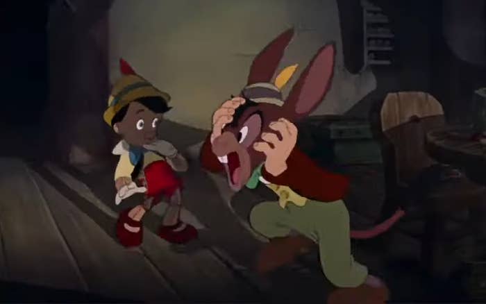 Pinocchio and Lampwick in a wooden room, Lampwick shows surprise with hands on his face that looks like a donkey