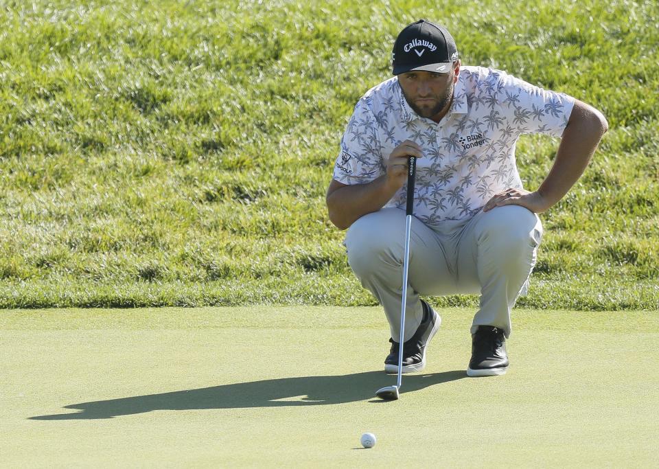 Jon Rahm lines up his putt on 18 during the conclusion of the second round of the Memorial Tournament at Muirfield Village Golf Club in Dublin, Ohio on Saturday, June 5, 2021. The round was stopped on Friday night because of darkness.