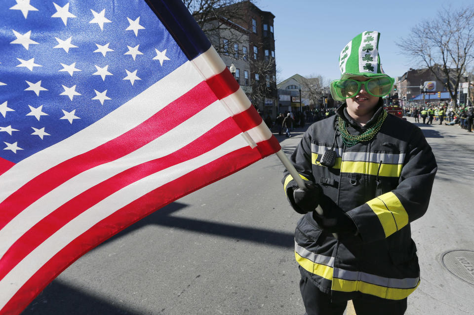 Chris Davern marches in the annual St. Patrick's Day parade in the South Boston neighborhood of Boston, Sunday, March 16, 2014. (AP Photo/Michael Dwyer)