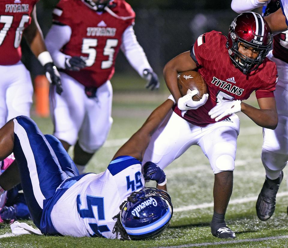 Gadsden City's TJ Worthy tries to evade the tackle of Lee Huntsville's Caleb Hill during high school football action in Gadsden, Alabama October 14, 2022. (Dave Hyatt: The Gadsden Times)