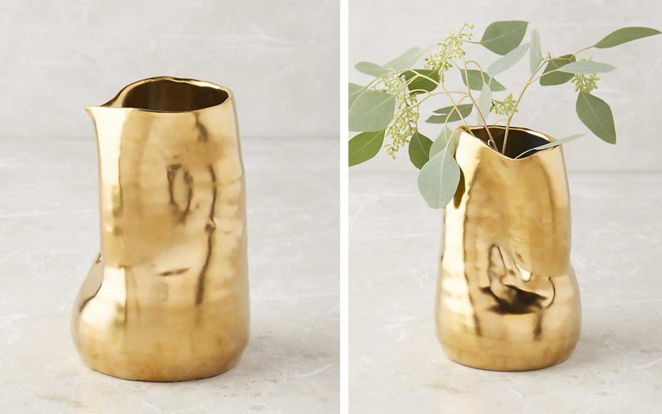 <p>Looking for a statement piece? This textured gold vase was made for showing off oversized, dried blooms—or standing alone on a coffee table.</p> <p>To buy: <a rel="nofollow noopener" href="http://click.linksynergy.com/fs-bin/click?id=93xLBvPhAeE&subid=0&offerid=460756.1&type=10&tmpid=16680&RD_PARM1=https%3A%2F%2Fwww.anthropologie.com%2Fshop%2Fgoldshine-vase%3Fcolor%3D070&u1=TLFASsheL150Under50GiftGuideEO11016" target="_blank" data-ylk="slk:Anthropologie;elm:context_link;itc:0;sec:content-canvas" class="link ">Anthropologie</a>, $16</p>