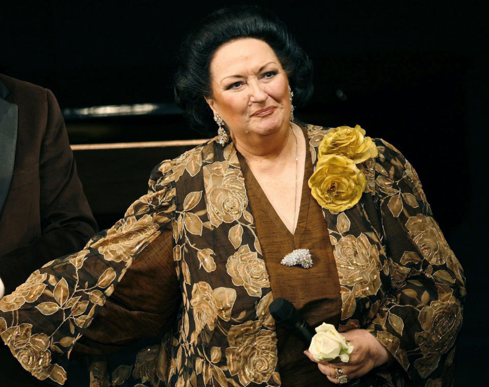 FILE - In this Nov. 17, 2006, file photo, Spanish soprano Montserrat Caballe, with Swiss moderator Kurt Aeschbacher, not in photo, welcomes the public on the occasion of the celebration of her 50th stage anniversary in Basel, Switzerland. Montserrat Caballe, a Spanish opera singer renowned for her bel canto technique and her interpretations of the roles of Rossini, Bellini and Donizetti, has died. She was 85. Hospital Sant Pau spokesman Abraham del Moral confirmed her death early Saturday, Oct. 6, 2018, to The Associated Press.(Georgios Kefalas/Keystone via AP, File)