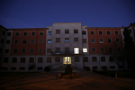 The Padres Trinitarios school, where philosophy teacher Teresa Conde, 52, says she was raped by a priest 30 years her senior when she was 14, is seen at dusk in Salamanca, Spain, February 7, 2019. REUTERS/Susana Vera