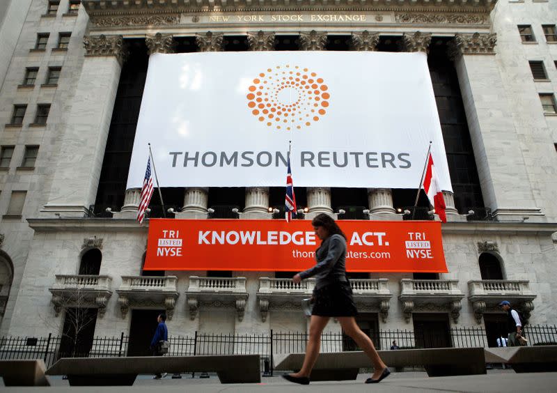 FILE PHOTO: The front of The New York Stock Exchange displays the new Thomson Reuters logo as the stock is traded for the first time in New York