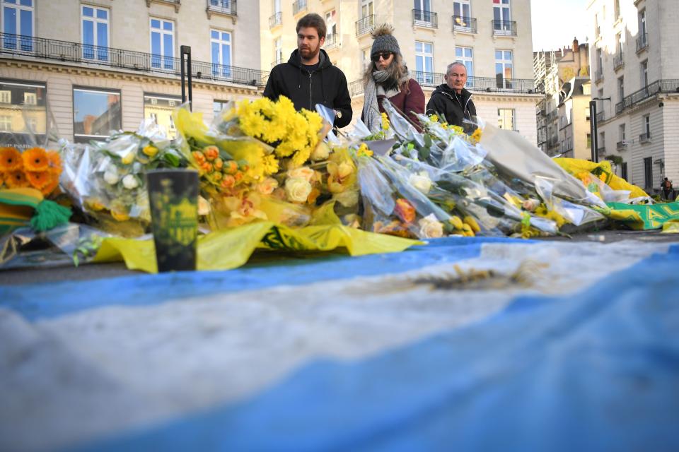 Supporters pay their respects in the main square of Nantes