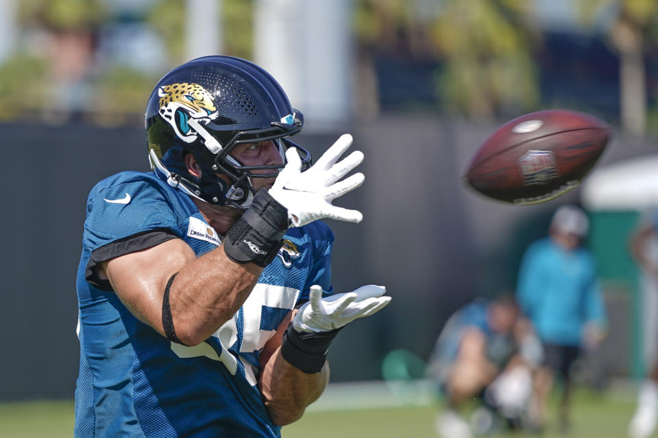 Jacksonville Jaguars tight end Tim Tebow makes a reception during a drill at NFL football practice, Saturday, July 31, 2021, in Jacksonville, Fla. (AP Photo/John Raoux)