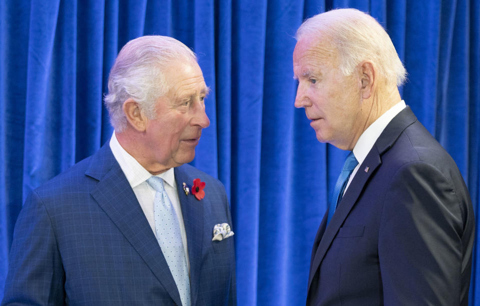 FILE - Britain's Prince Charles, left, greets the President of the United States Joe Biden ahead of their bilateral meeting during the Cop26 summit at the Scottish Event Campus (SEC) in Glasgow, Scotland, Nov. 2, 2021. Charles and Biden discussed global cooperation on the climate crisis last year while both attended a summit in Glasgow, Scotland. (Jane Barlow/Pool Photo via AP, File)