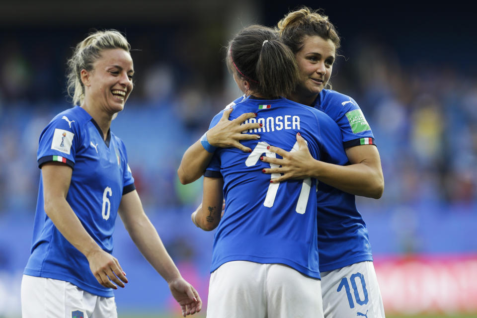 Italy's Barbara Bonansea, center, Martina Rosucci, left, and Cristiana Girelli celebrate at the end of the Women's World Cup round of 16 soccer match between Italy and China at Stade de la Mosson in Montpellier, France, Tuesday, June 25, 2019. Italy won 2-0. (AP Photo/Claude Paris)