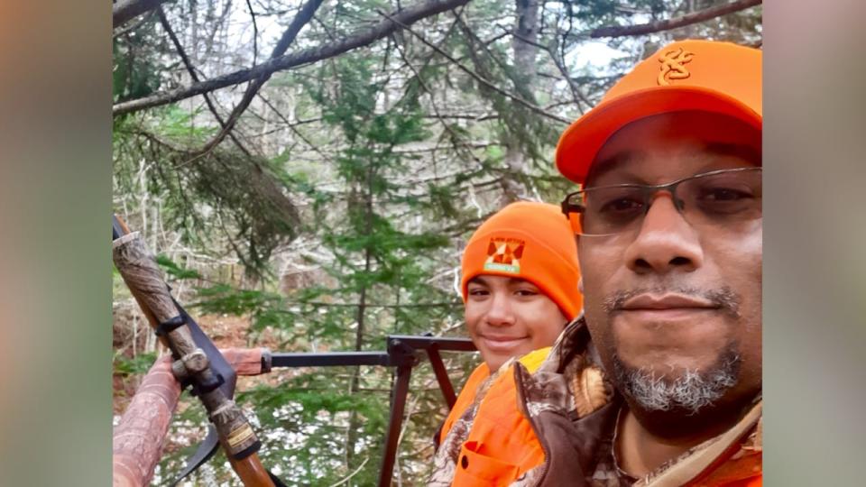 Matthew Currie, right, shown here with his son while hunting, has won a human rights ruling against Bear River First Nation.