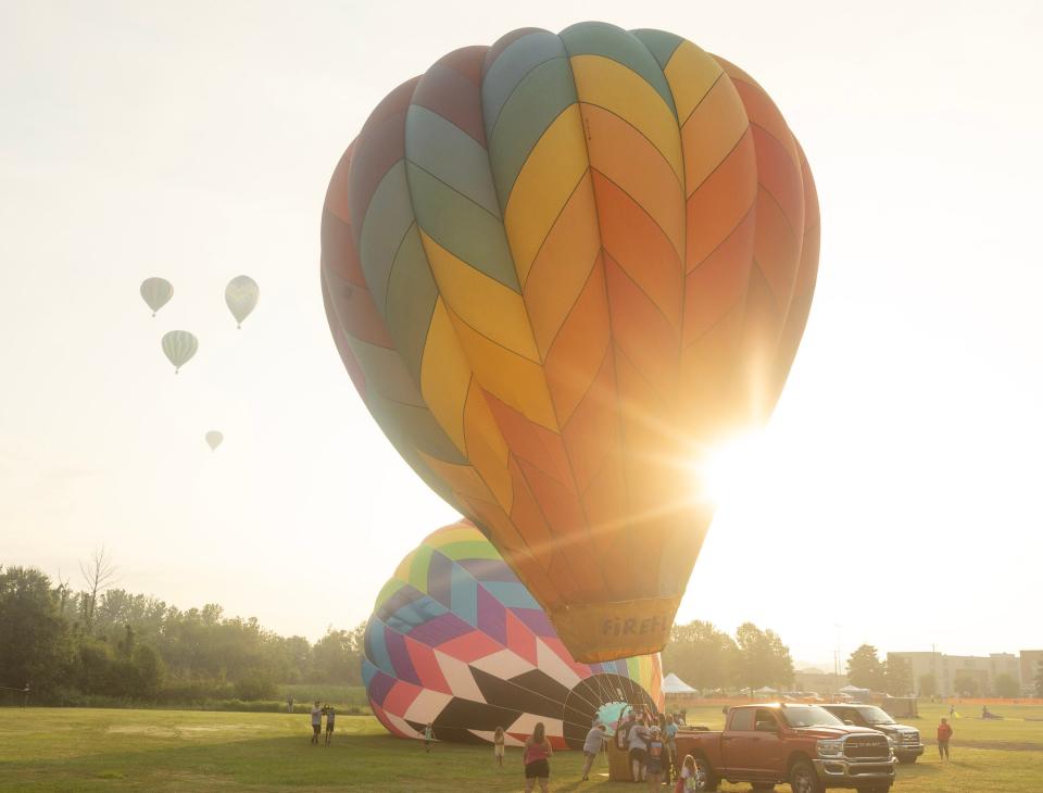 Balloons sit Friday morning waiting to launch at Kent State Stark University's Stark campus in Jackson Township during the media/sponsor flight at the 2023 Balloon Classic.