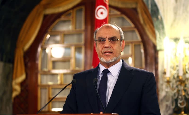 FILE PHOTO: Tunisia's Prime Minister Hamadi Jebali speaks as he announces his resignation during a news conference in Tunis