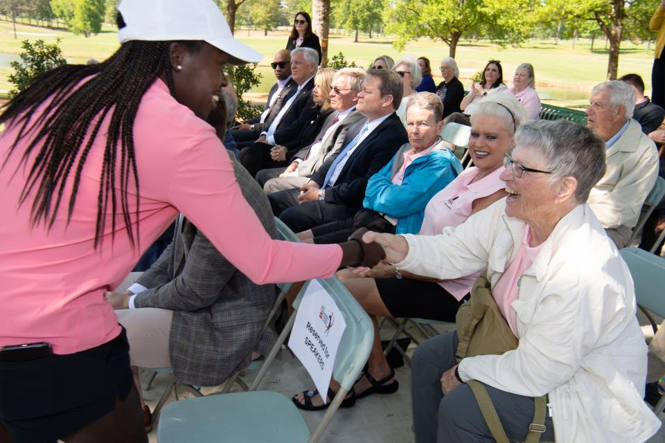 Lakareber Abe, former University of Alabama golfer and current player on the Epson Tour, shakes hands with Virginia Cox during a press conference to announce the Tuscaloosa Toyota Classic, an LPGA Epson Tour event at Ol’ Colony Golf Complex Thursday, April 14, 2022. Gary Cosby Jr./Tuscaloosa News  