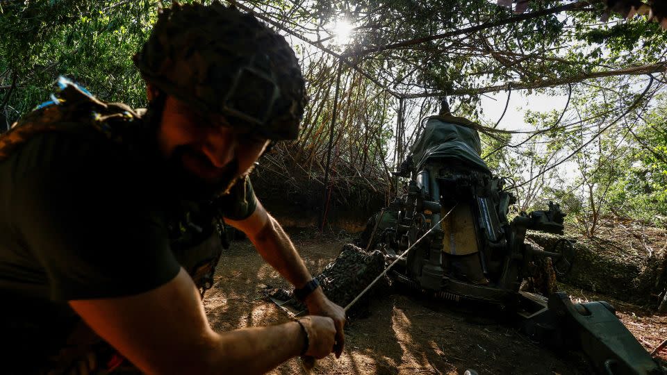 A Ukrainian serviceman fires a howitzer toward Russian troops in Donetsk region. - Valentyn Ogirenko/Reuters