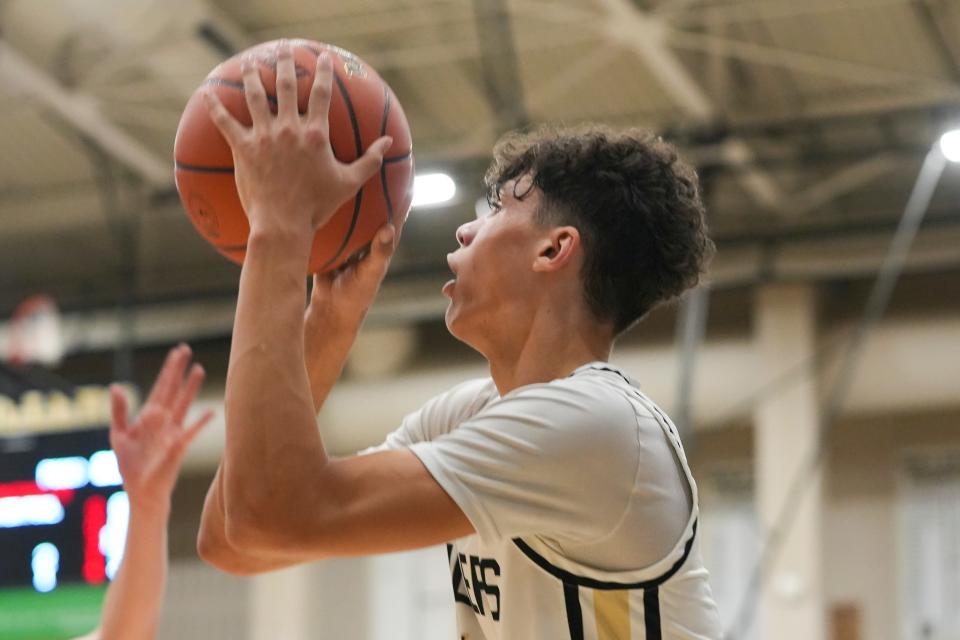 Noblesville Millers Justin Curry (10) shoots a three-pointer, Tuesday, Feb. 27, 2024, during the Class 4A sectional game at Noblesville High School in Noblesville, Indiana. Noblesville beat Zionsville 67-49 and will advance to play the Westfield Shamrocks in the Class 4A semifinals game on March 1.