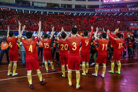 FILE PHOTO - Football Soccer - China v South Korea - 2018 World Cup Qualifiers - Changsha, China - 23/3/17 - Team China celebrates after winning against South Korea. REUTERS/Stringer