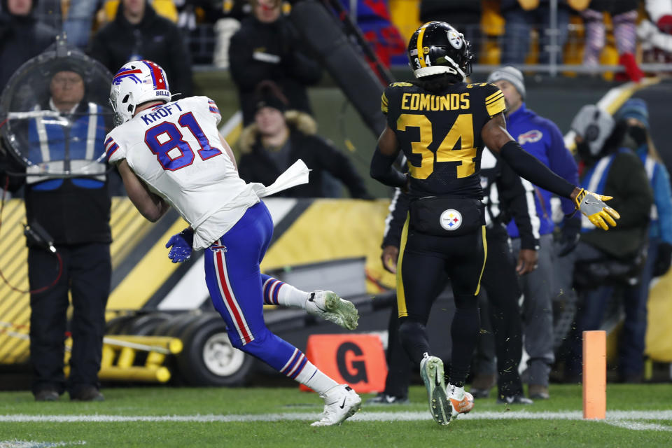 Buffalo Bills tight end Tyler Kroft (81) scores on a pass from quarterback Josh Allen, running near Pittsburgh Steelers strong safety Terrell Edmunds (34), during the second half of an NFL football game in Pittsburgh, Sunday, Dec. 15, 2019. (AP Photo/Keith Srakocic)