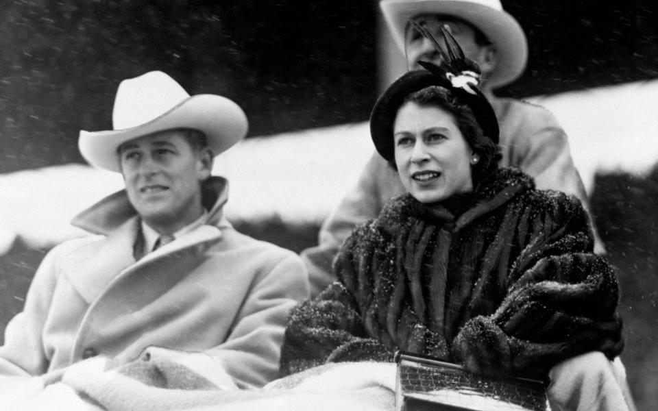 In a photo from 1951, the then Princess Elizabeth and the Duke of Edinburgh watched a 'stampede' rodeo staged especially for them in Calgary, Alberta, during their tour of Canada. - PA