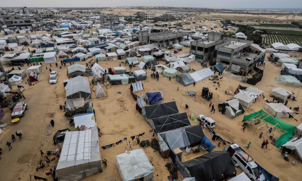 <span>Displaced Palestinians in makeshift tents in al-Mawasi. The area was declared a safe zone by the Israeli military but has come under numerous attacks.</span><span>Photograph: Ahmad Hasaballah/Getty</span>