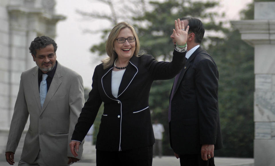 U.S. Secretary of State Hillary Rodham Clinton, waves during a visit to the Victoria Memorial Hall in Kolkata, India, Sunday, May 6, 2012. Clinton arrived in the former colonial capital of 14 million on Sunday after visits to China and Bangladesh. (AP Photo)