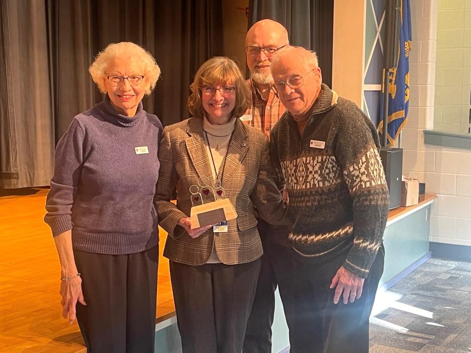 Rebecca Hutzell, center, is pictured with her parents, Britta and Carl Mitchell, in front, and her husband, Rodger Hutzell, in the background.