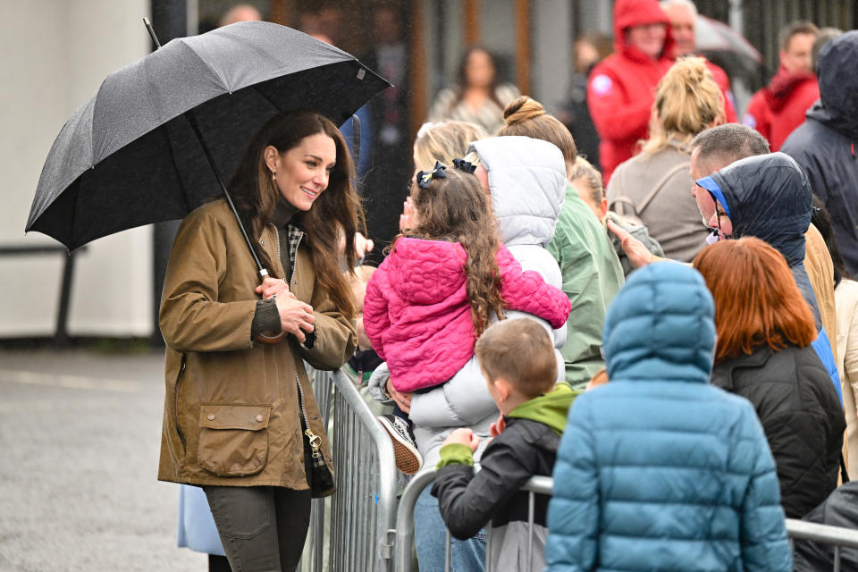 The Princess of Wales speaking with people outside Dowlais Rugby Club during a 2 day visit to Wales on April 27, 2023. (Samir Hussein / Samir Hussein/WireImage)