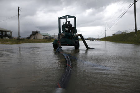 A pump is used to drain water from a flooded street after Tropical Storm Gordon in Dauphin Island, Alabama, U.S., September 5, 2018. REUTERS/Jonathan Bachman