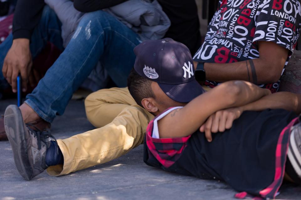 Venezuelan migrants are staying in front and across the street of Sacred Heart Church, on Wednesday, April 26, 2023, after crossing into the U.S.