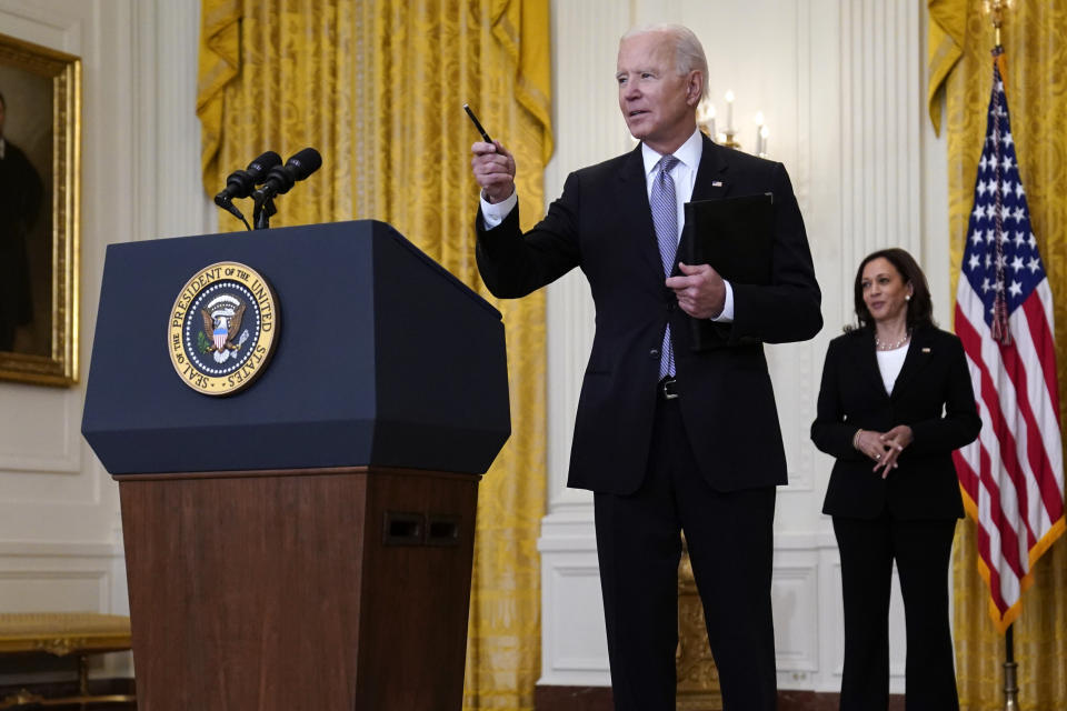 Vice President Kamala Harris watches as President Joe Biden takes a question from a reporter after speaking about distribution of COVID-19 vaccines, in the East Room of the White House, Monday, May 17, 2021, in Washington. (AP Photo/Evan Vucci)