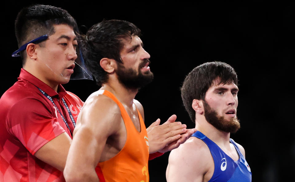 CHIBA, JAPAN - AUGUST 5, 2021: Indias Kumar Ravi (C) and ROC's Zaur Uguev (R) after the men's freestyle 57kg final wrestling bout at the 2020 Summer Olympic Games, at the Makuhari Messe convention center. Stanislav Krasilnikov/TASS (Photo by Stanislav Krasilnikov\TASS via Getty Images)