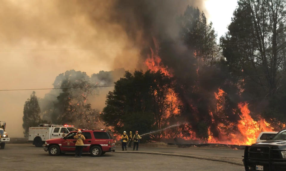 Wind-driven wildfires threatened homes in Northern California