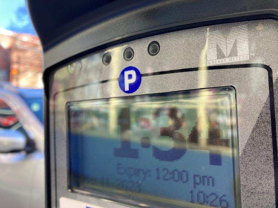 A close view of the MacKay logo on a Broadway Street parking meter in downtown Asheville.