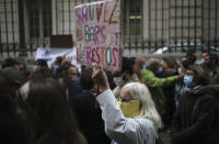 Angry restaurant and bar owners demonstrate, one with a placard reading "Save cafes and restaurants" in Marseille, southern France, Friday Sept. 25, 2020 to challenge a French government order to close all public venues as of Saturday to battle resurgent virus infections. The protesters, and local officials in France's second-biggest city, are also threatening legal action, to try to block the order via the courts. They argue that Marseille's virus case rise has been stabilizing, and that the central government in Paris is unfairly singling out Marseille for the toughest virus measures in the nation. (AP Photo/Daniel Cole)