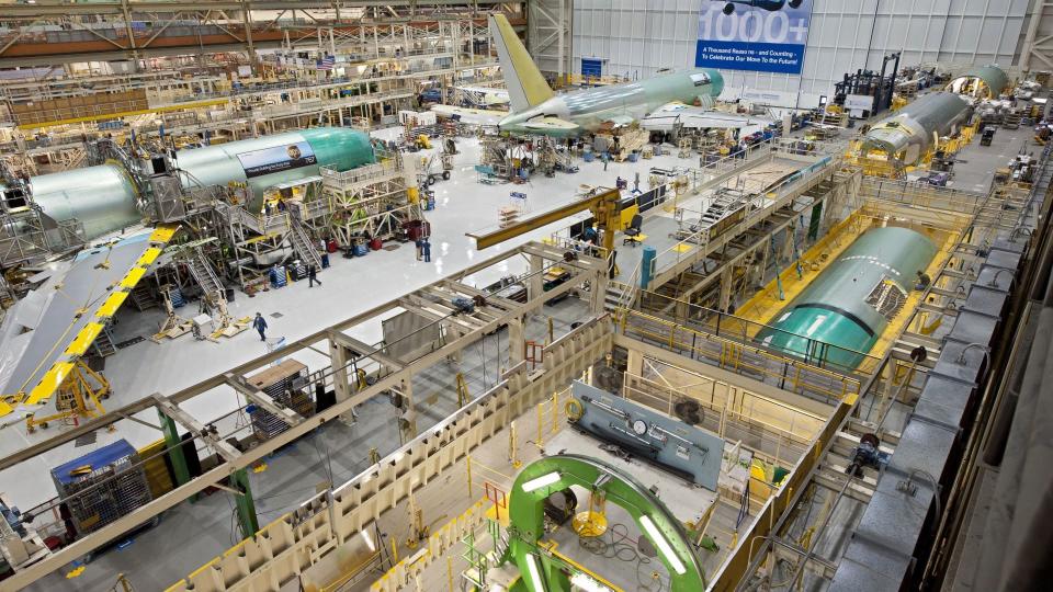 Inside view of airplanes being assembled at the Boeing factory.