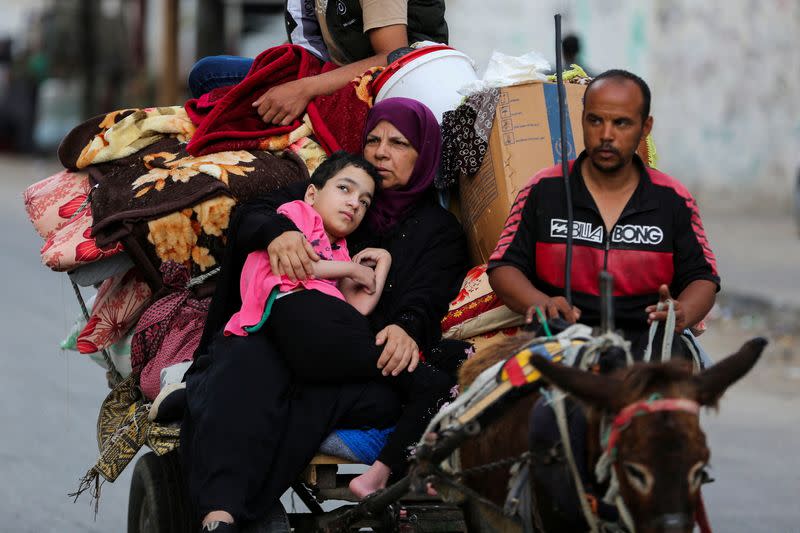 FILE PHOTO: Palestinians flee Rafah due to an Israeli military operation, in Rafah, in the southern Gaza Strip